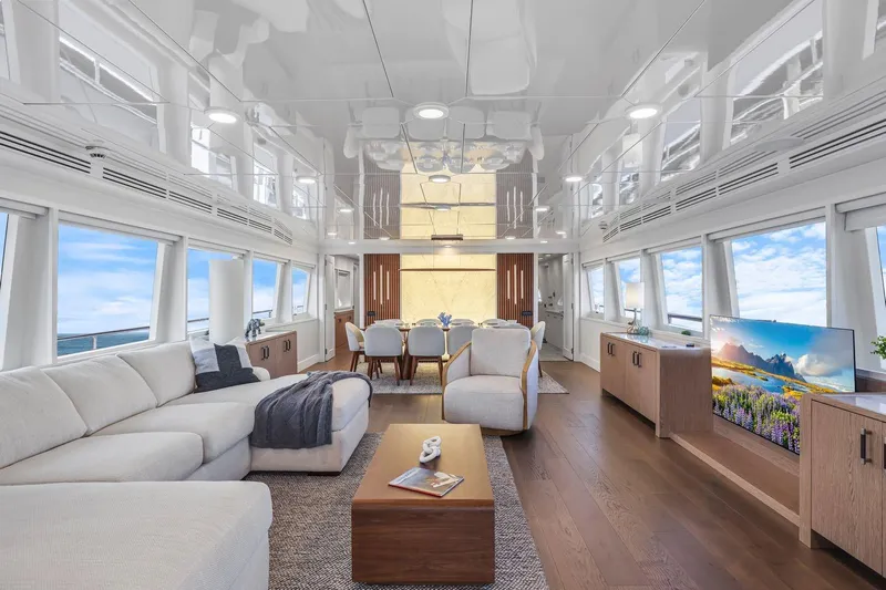 Panacea Yacht Photos Pics Luxurious interior of 2011 Mengi Yay 115 MY yacht with modern furnishings and panoramic windows.