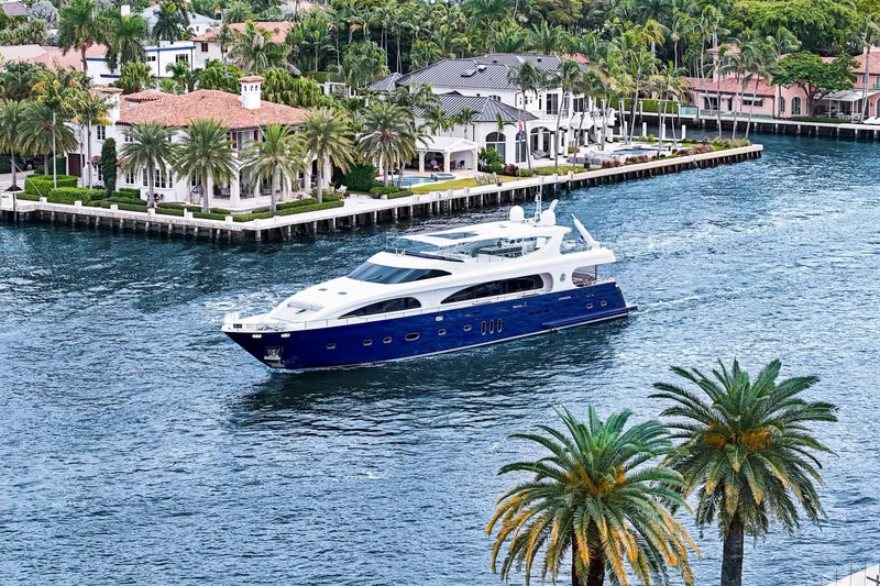 Panacea Yacht Photos Pics Luxurious 2011 Mengi Yay 115 MY yacht cruising near waterfront homes and palm trees.