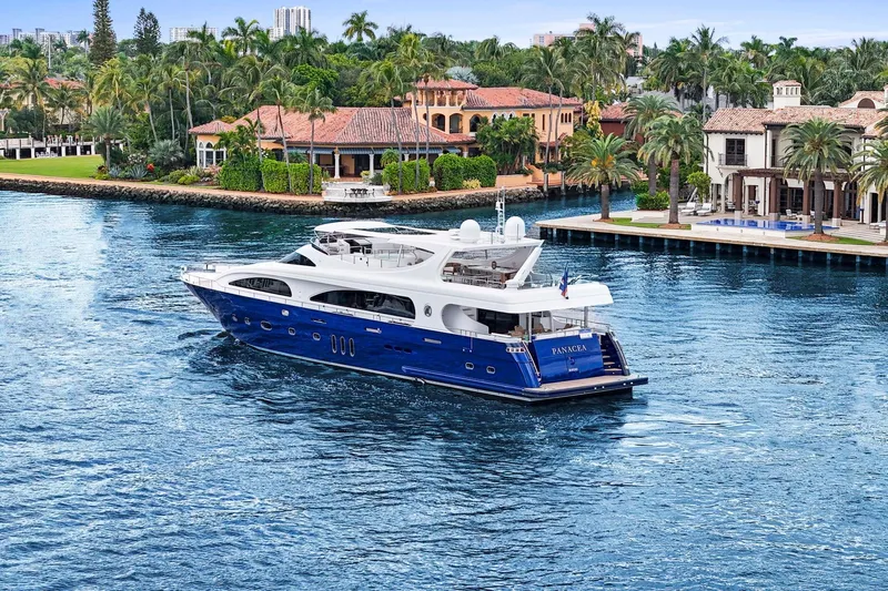 Panacea Yacht Photos Pics Luxurious 2011 Mengi Yay 115 MY yacht cruising near waterfront mansions and palm trees.