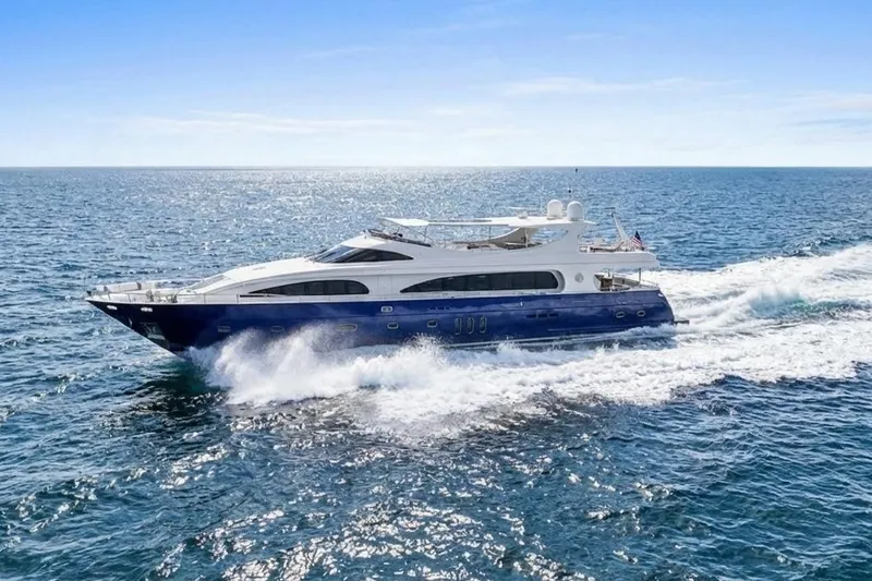 Panacea Yacht Photos Pics Luxurious 2011 Mengi Yay 115 MY yacht cruising on open sea under clear blue sky.