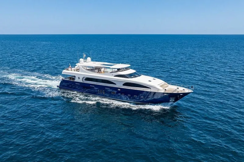 Panacea Yacht Photos Pics Luxurious 2011 Mengi Yay 115 MY yacht cruising on open sea under clear blue sky.