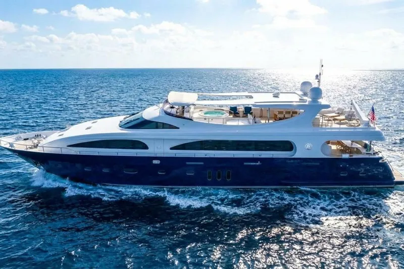 Panacea Yacht Photos Pics Luxurious 2011 Mengi Yay 115 MY yacht cruising on open sea under clear skies.