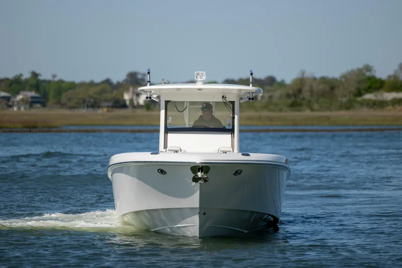 Yacht Photos Pics 2017 Everglades 355 Tournament boat cruising on a calm lake.