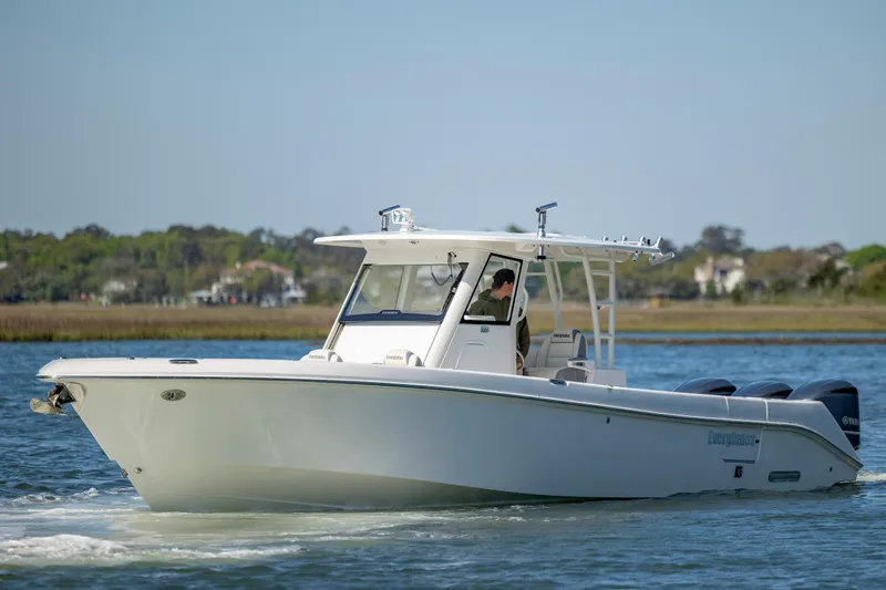  Yacht Photos Pics 2017 Everglades 355 Tournament boat cruising on calm water.
