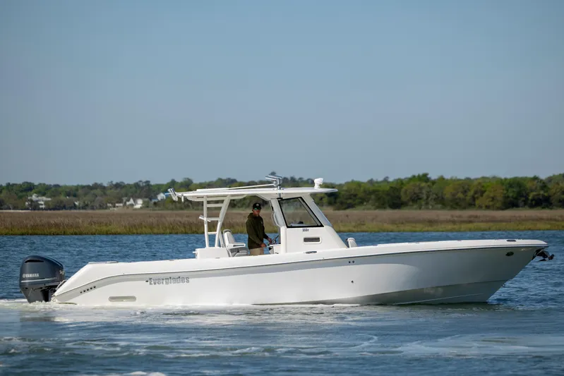  Yacht Photos Pics 2017 Everglades 355 Tournament boat cruising on a calm lake.