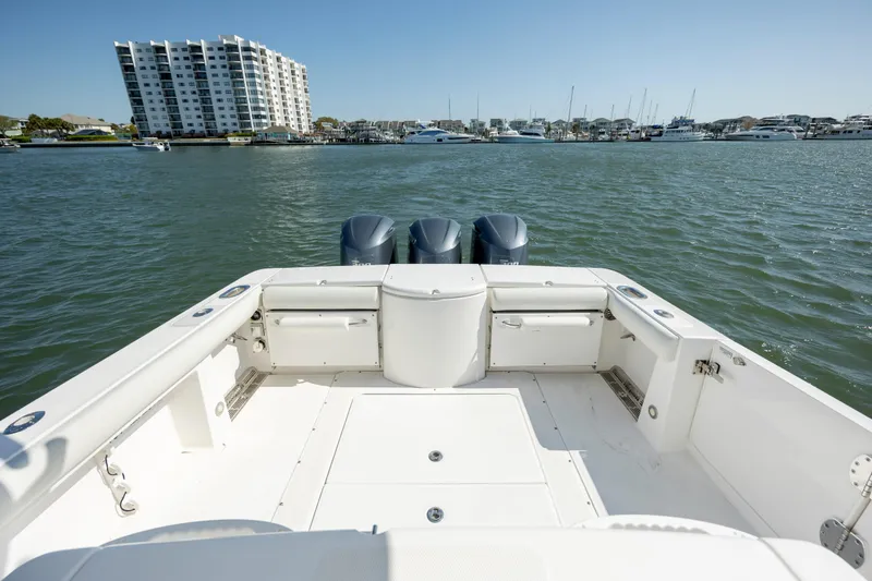  Yacht Photos Pics 2017 Everglades 355 Tournament boat on water, with marina and buildings in background.