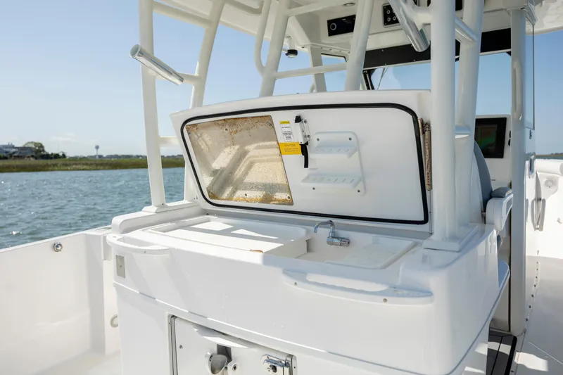  Yacht Photos Pics 2017 Everglades 355 Tournament boat interior with open storage compartment.