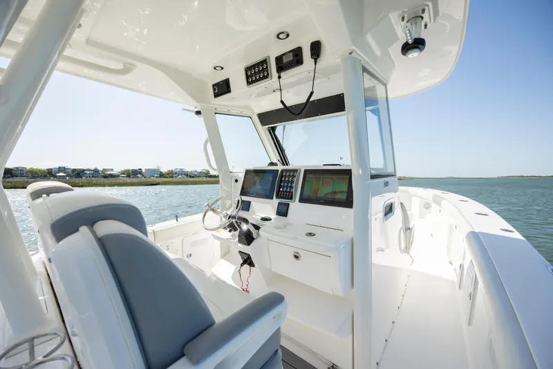  Yacht Photos Pics 2017 Everglades 355 Tournament boat cockpit with advanced navigation systems and comfortable seating.