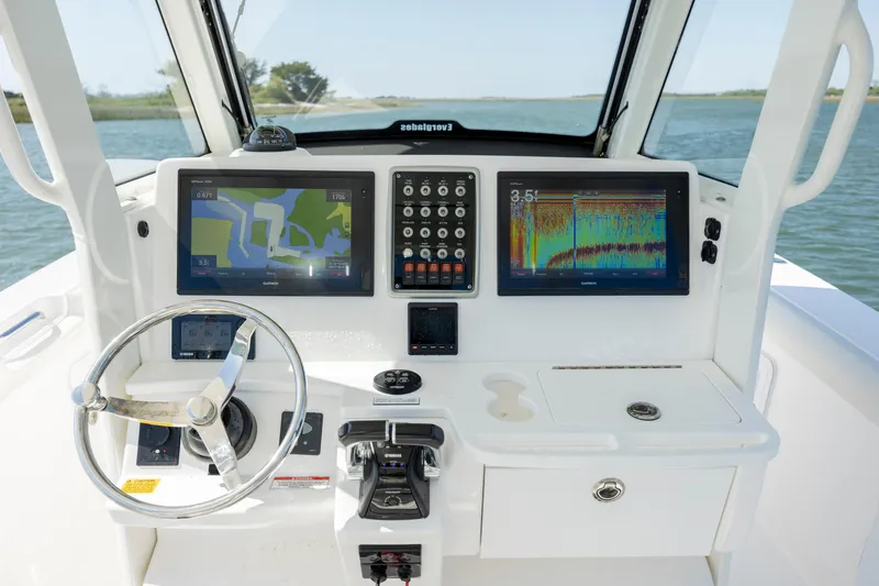 Yacht Photos Pics 2017 Everglades 355 Tournament boat dashboard with navigation screens and controls.