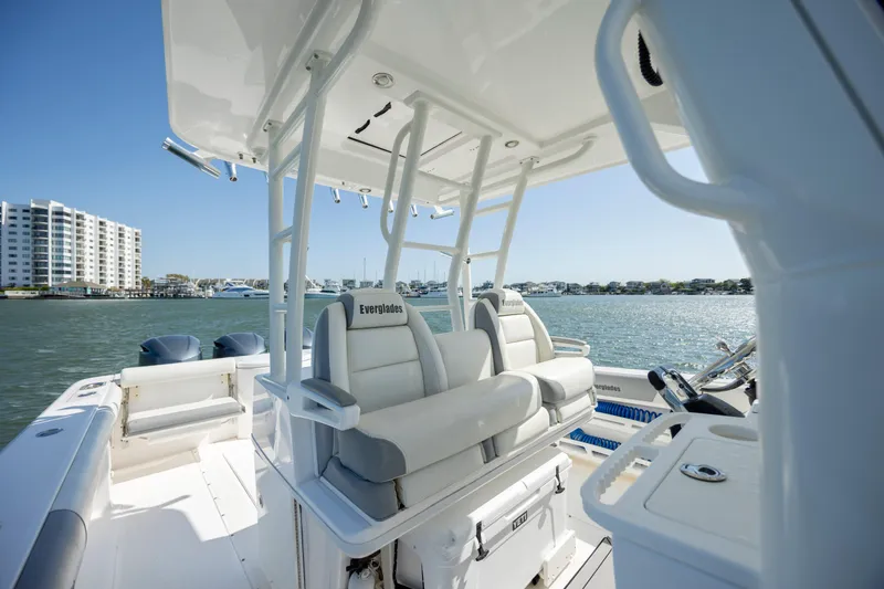  Yacht Photos Pics 2017 Everglades 355 Tournament boat interior with seating, overlooking waterfront buildings.