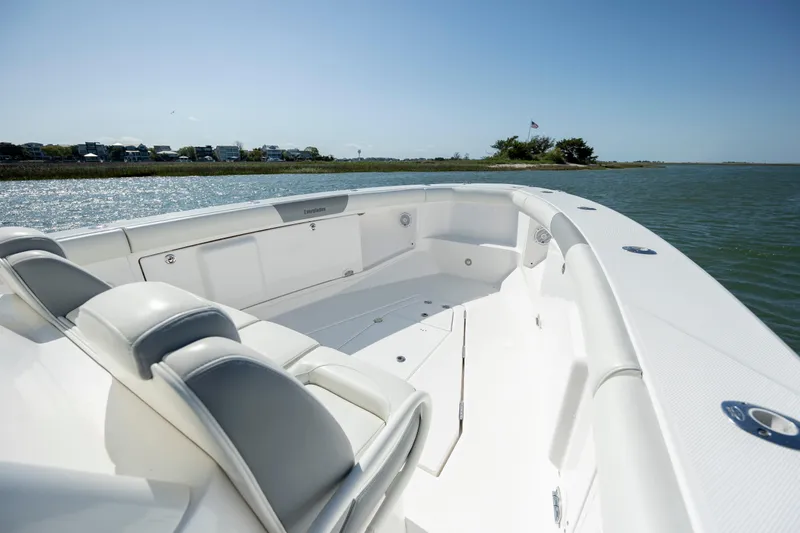  Yacht Photos Pics 2017 Everglades 355 Tournament boat interior with seating, on calm water.