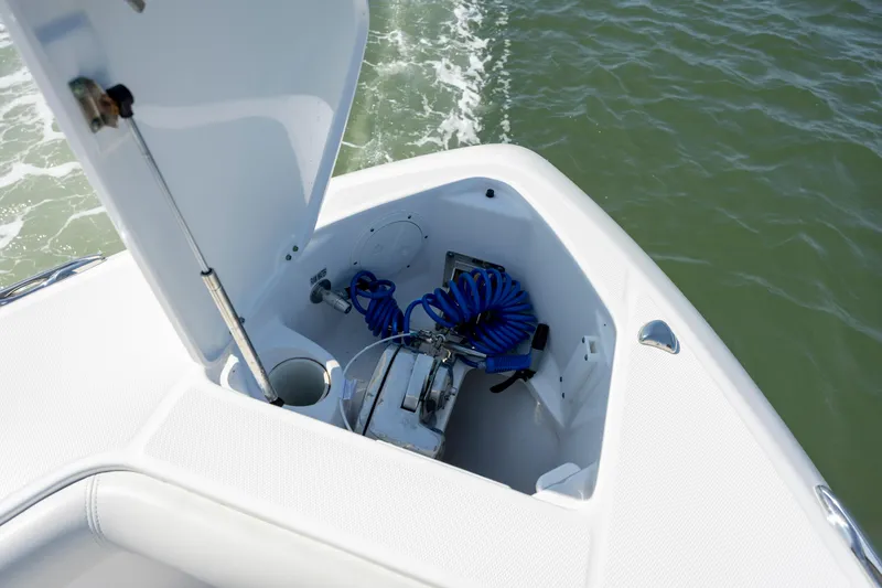  Yacht Photos Pics 2017 Everglades 355 Tournament boat storage compartment with coiled blue hose.