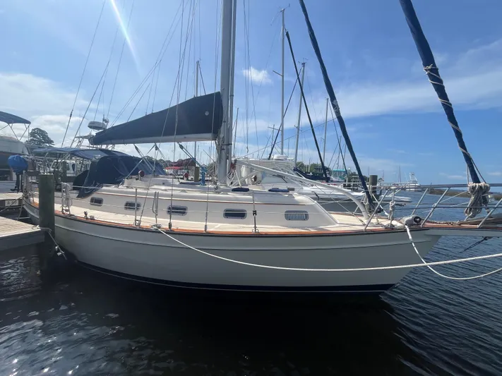  Yacht Photos Pics 1997 Island Packet 350 sailboat docked at marina under clear blue sky.