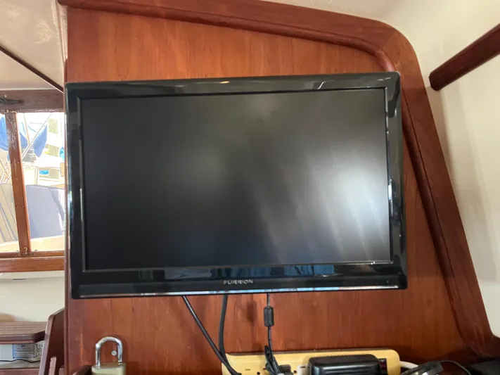  Yacht Photos Pics Flat-screen TV mounted on a 1997 Island Packet 350 sailboat interior.