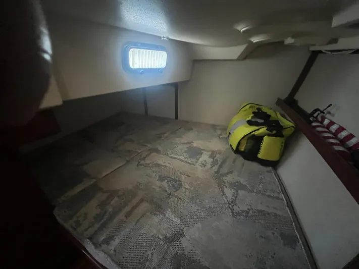  Yacht Photos Pics Interior cabin of 1997 Island Packet 350 sailboat with window and gear bag.