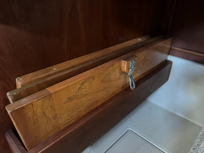  Yacht Photos Pics Wooden storage compartment on a 1997 Island Packet 350 sailboat interior.