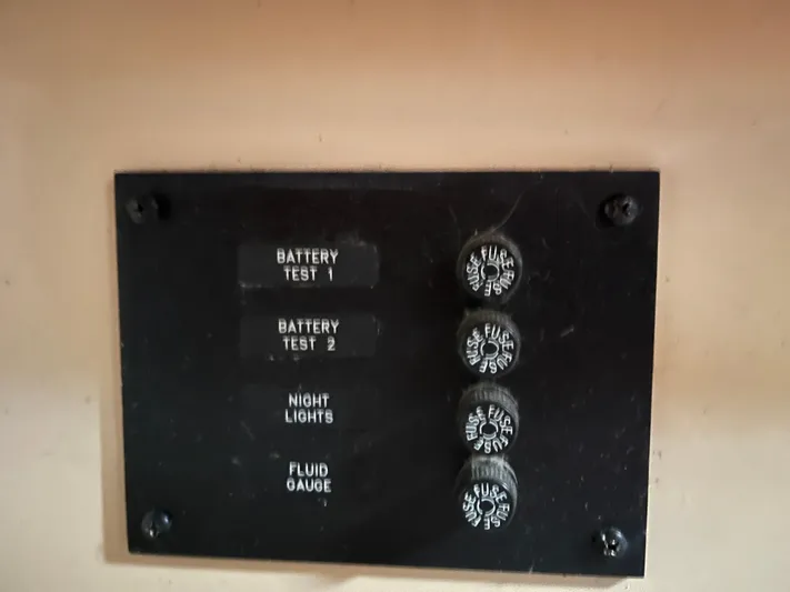  Yacht Photos Pics Control panel with battery tests, night lights, and fluid gauge for 1997 Island Packet 350.