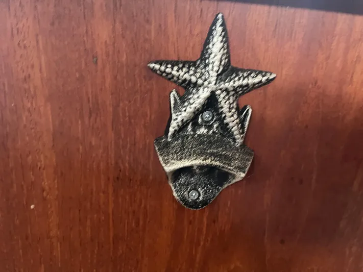  Yacht Photos Pics Starfish-shaped bottle opener on Island Packet 350 sailboat, 1997 model.