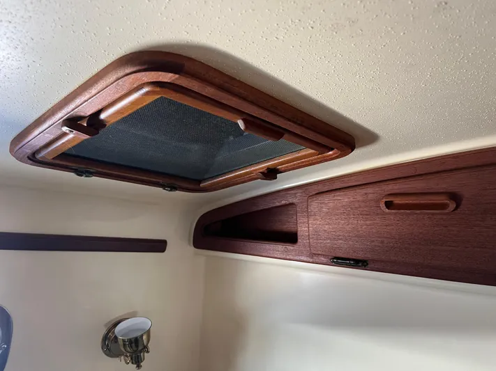  Yacht Photos Pics Wooden interior detail of a 1997 Island Packet 350 sailboat cabin.