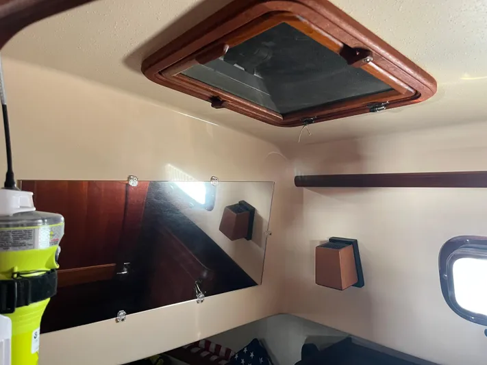  Yacht Photos Pics Interior of 1997 Island Packet 350 sailboat with hatch, mirror, and window.