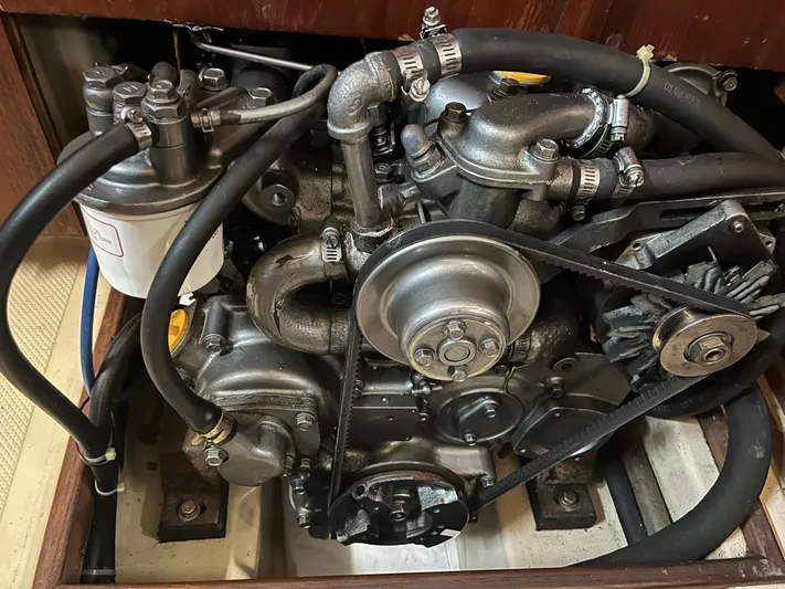  Yacht Photos Pics Engine of a 1997 Island Packet 350 sailboat, showcasing mechanical components and hoses.