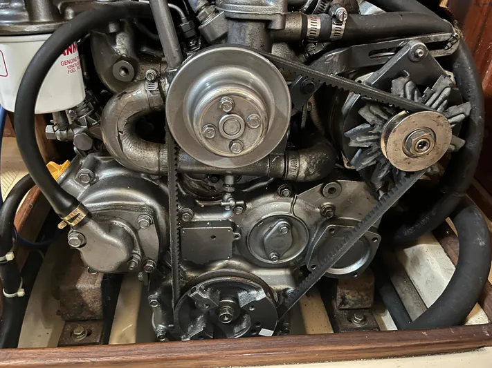  Yacht Photos Pics Engine of a 1997 Island Packet 350 sailboat, showcasing mechanical components and belts.