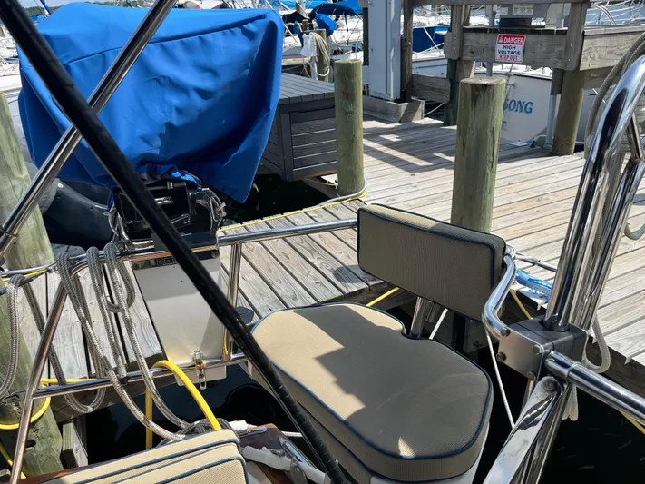  Yacht Photos Pics 1997 Island Packet 350 sailboat docked, featuring cushioned seating and nautical equipment.