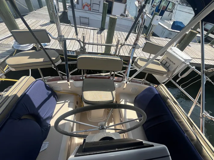  Yacht Photos Pics Cockpit view of a 1997 Island Packet 350 sailboat docked at a marina.