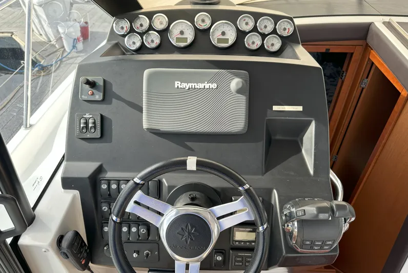 Tea Moana Yacht Photos Pics 2016 Jeanneau NC 11 helm with Raymarine navigation system and gauges.