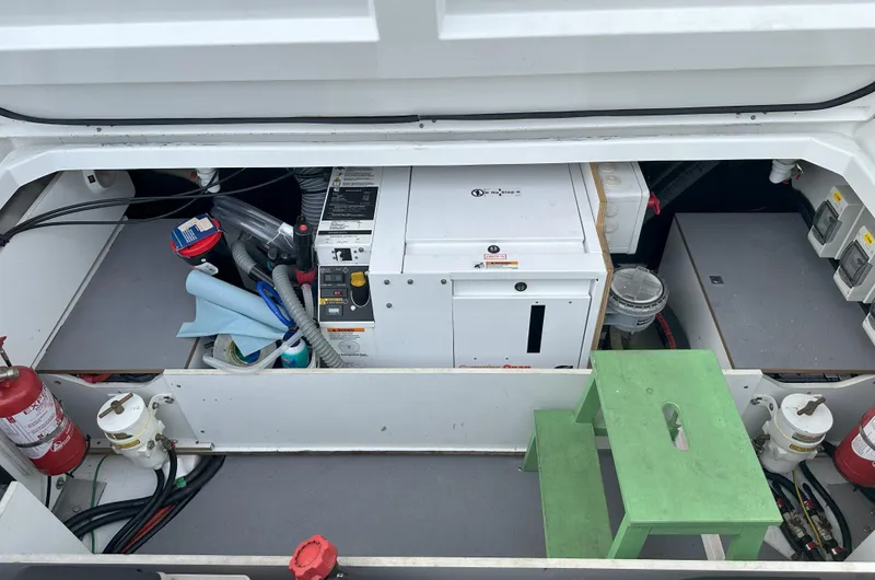 Tea Moana Yacht Photos Pics Engine compartment of 2016 Jeanneau NC 11 with equipment and fire extinguishers.