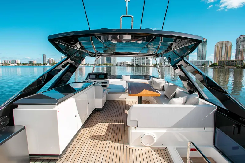 Our Trade Yacht Photos Pics Luxurious 2022 Ferretti Yachts 670 with spacious deck and modern amenities, docked in a scenic marina.