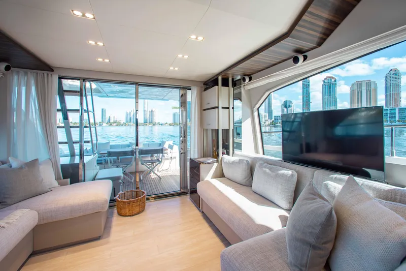 Our Trade Yacht Photos Pics Luxurious interior of 2022 Ferretti Yachts 670 with waterfront view and modern furnishings.