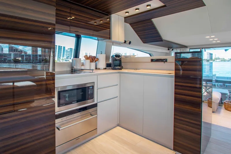 Our Trade Yacht Photos Pics Luxurious kitchen interior of 2022 Ferretti Yachts 670 with modern appliances and sleek design.
