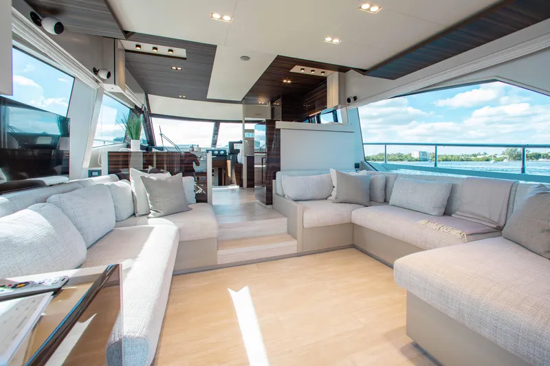 Our Trade Yacht Photos Pics Luxurious interior of 2022 Ferretti Yachts 670 with spacious seating and panoramic windows.