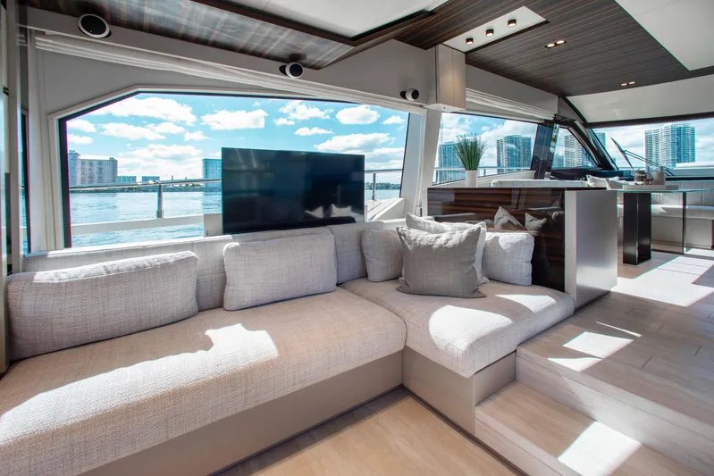 Our Trade Yacht Photos Pics Luxurious interior of 2022 Ferretti Yachts 670 with plush seating and waterfront view.