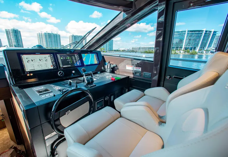 Our Trade Yacht Photos Pics Luxurious helm of 2022 Ferretti Yachts 670 with modern controls and waterfront view.