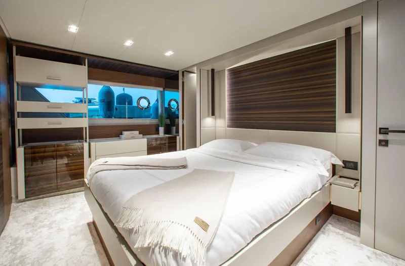 Our Trade Yacht Photos Pics Luxurious bedroom interior of 2022 Ferretti Yachts 670, featuring modern design and elegant furnishings.