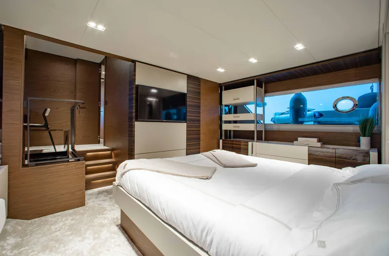 Our Trade Yacht Photos Pics Luxurious bedroom interior of 2022 Ferretti Yachts 670, featuring modern design and large windows.