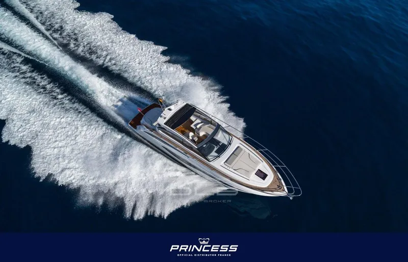  Yacht Photos Pics Aerial view of 2018 Princess V50 Open yacht cruising on blue ocean waters.