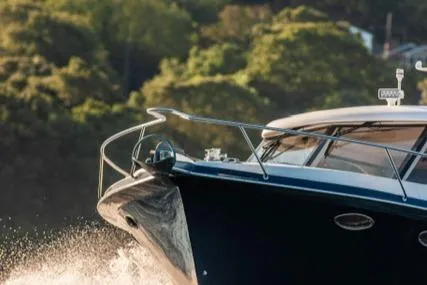  Yacht Photos Pics 2018 Hylas M44 yacht cruising on water with lush greenery in the background.