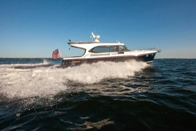  Yacht Photos Pics 2018 Hylas M44 yacht cruising on open water with American flag.
