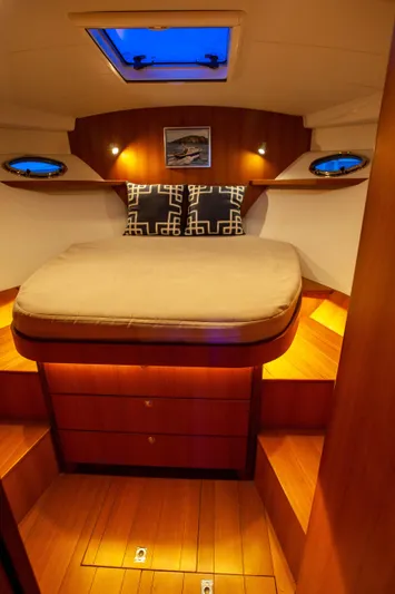  Yacht Photos Pics Luxurious 2018 Hylas M44 yacht cabin with elegant wood finish and cozy bedding.