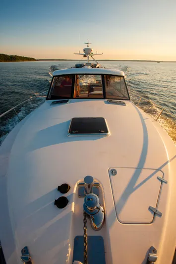  Yacht Photos Pics 2018 Hylas M44 yacht cruising on calm waters at sunset.