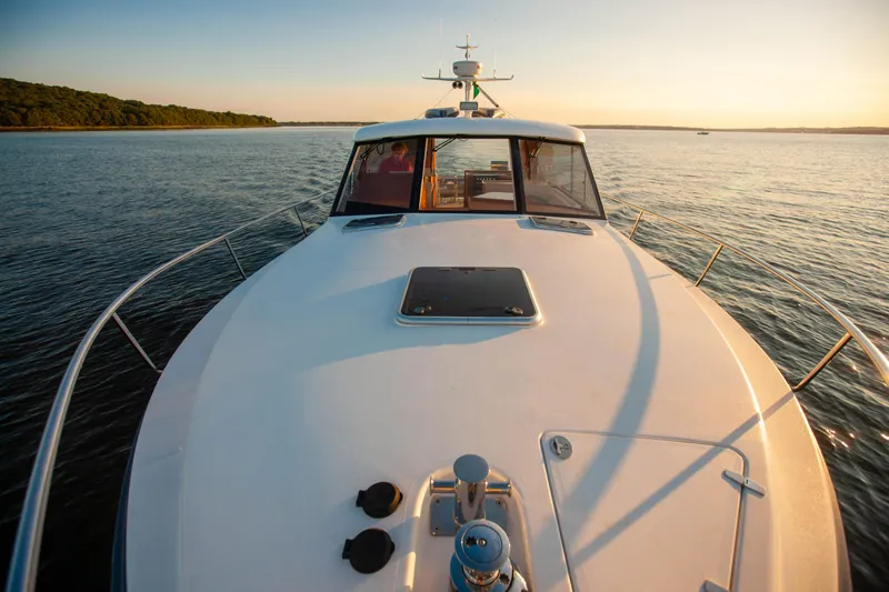  Yacht Photos Pics 2018 Hylas M44 yacht cruising on calm waters at sunset.