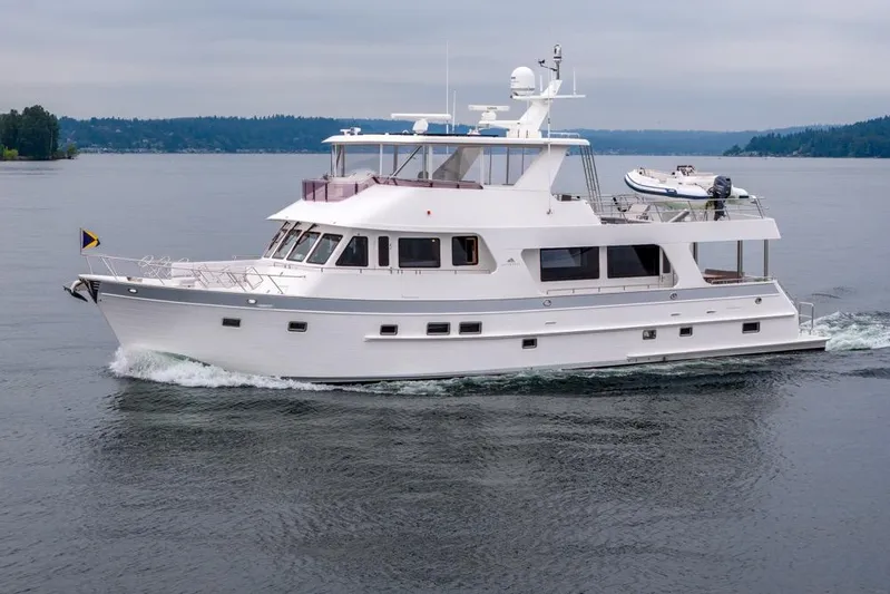 Smile Smile Smile Yacht Photos Pics 2022 Outer Reef 720 Motor Yacht cruising on calm waters.