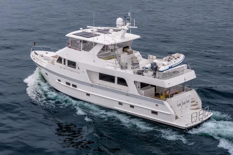 Smile Smile Smile Yacht Photos Pics 2022 Outer Reef 720 Motor Yacht cruising on open water.