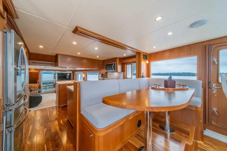 Smile Smile Smile Yacht Photos Pics Luxurious interior of 2022 Outer Reef 720 Motor Yacht with elegant wood finishes and modern amenities.