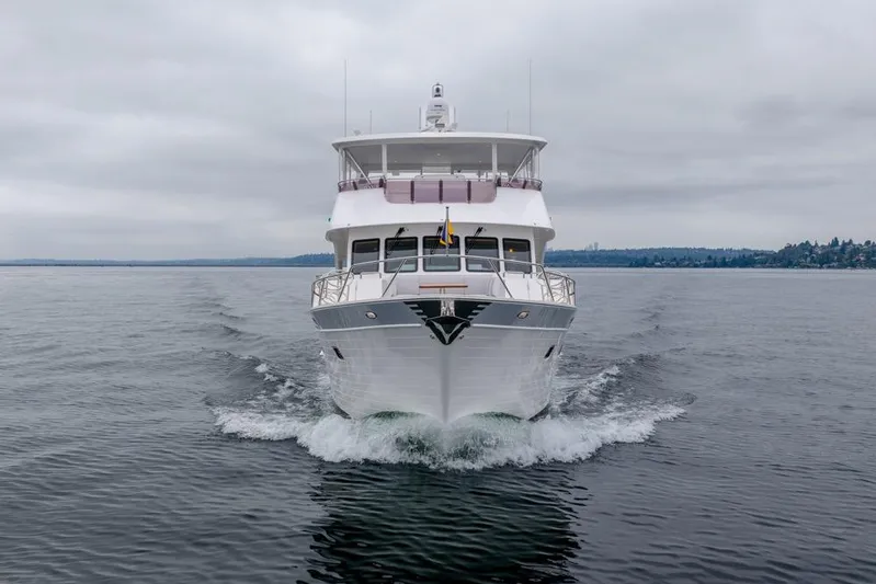 Smile Smile Smile Yacht Photos Pics 2022 Outer Reef Yachts 720 Motor Yacht cruising on calm waters under cloudy skies.