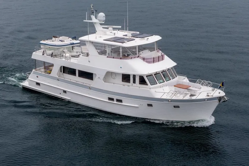 Smile Smile Smile Yacht Photos Pics 2022 Outer Reef 720 Motor Yacht cruising on open water.