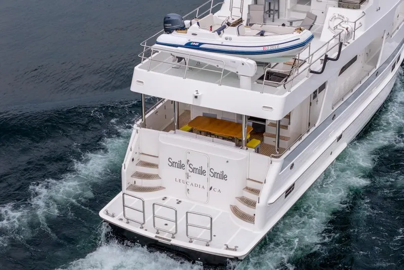 Smile Smile Smile Yacht Photos Pics 2022 Outer Reef 720 Motor Yacht cruising with tender on deck.
